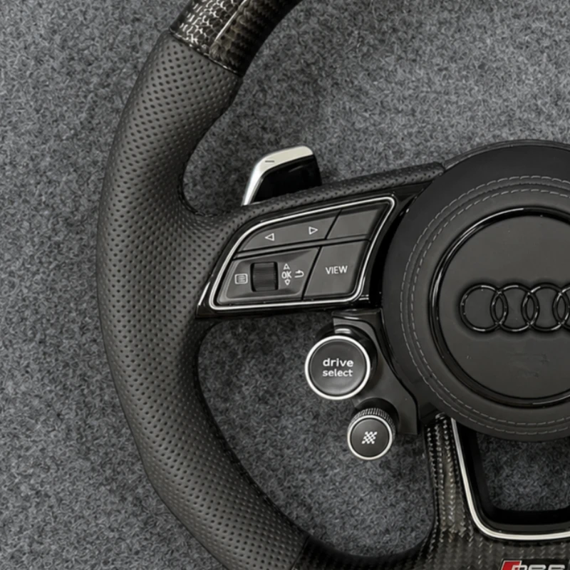 Breathable perforated leather grips closeup custom audi steering wheel Jionx