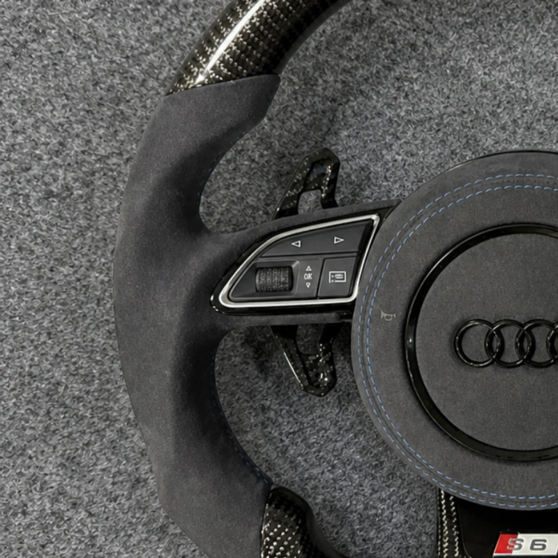 Soft black Alcantara leather grips with neat blue contrast stitching for Audi S6 sport wheel
