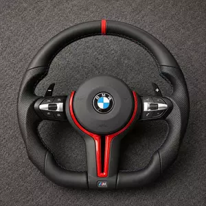 Custom BMW 7 Series leather steering wheel with red trim, perforated grips, paddle shifters and M-color stitching