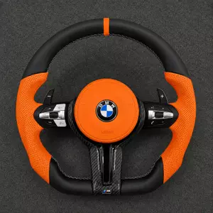 Custom orange Nappa leather steering wheel for BMW 2 Series M2 with real carbon fiber trim and perforated grips