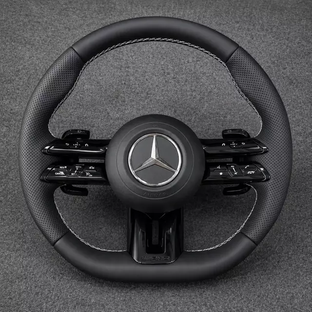 Mercedes C/E dragonfly-style black Nappa leather wheel with perforated grips, white stitching, black trim and paddles
