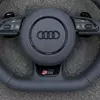 JIONX S Line sport metal badge closeup on Audi B8 OEM nappa steering wheel