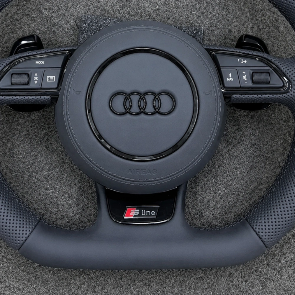 JIONX S Line sport metal badge closeup on Audi B8 OEM nappa steering wheel