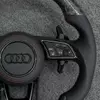 Shift paddles and multifunction control buttons Audi forged carbon steering wheel