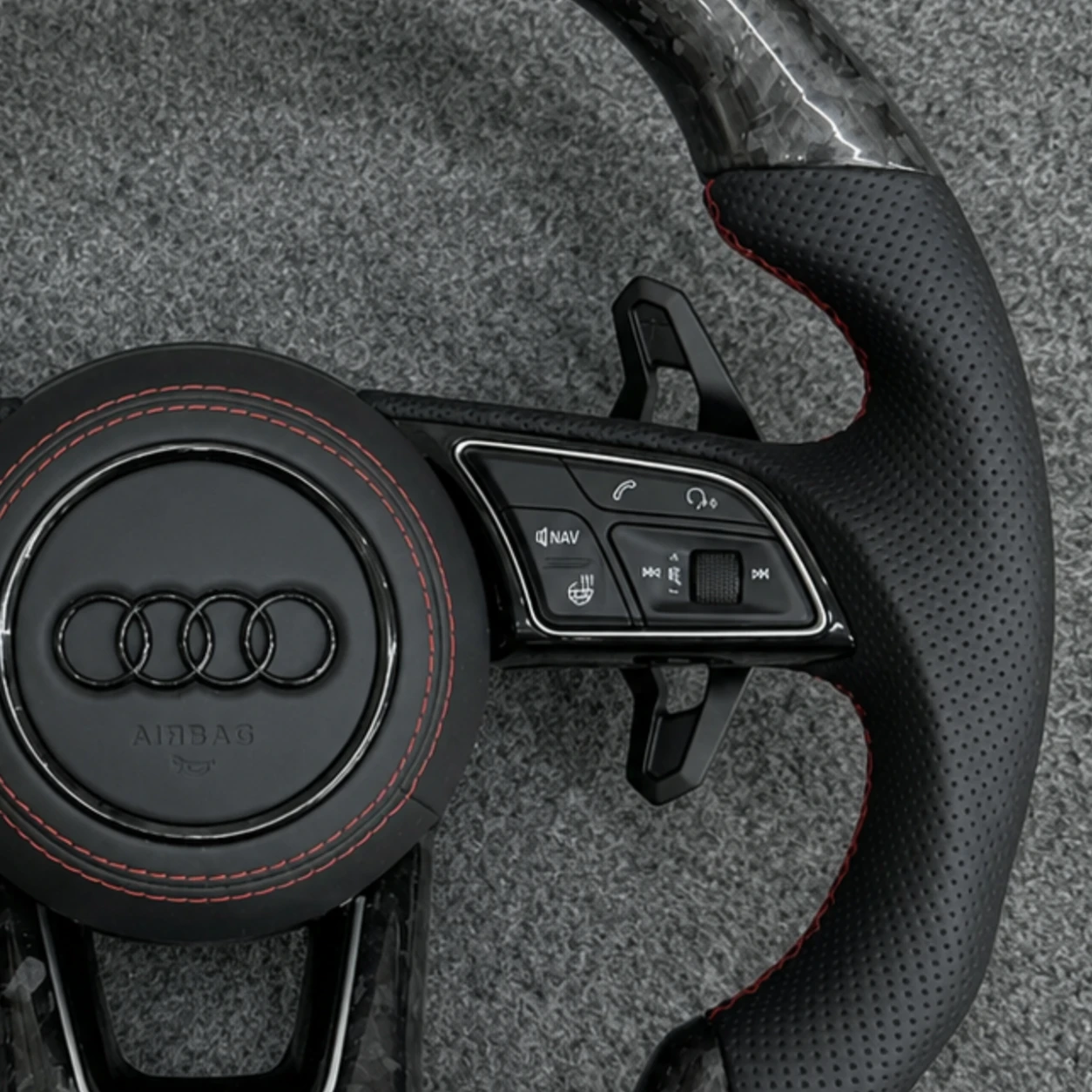 Shift paddles and multifunction control buttons Audi forged carbon steering wheel
